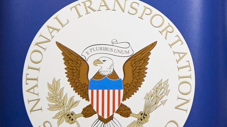 The National Transportation Safety Board logo is seen during a...