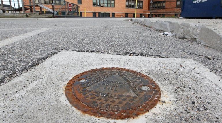 A monitoring well located in a municipal lot in the...