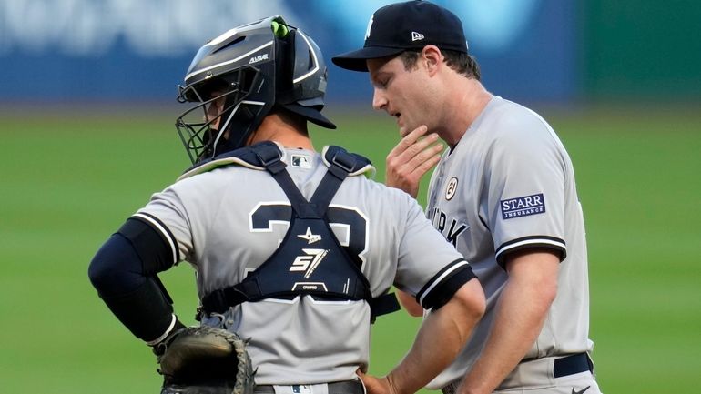 Yankees starting pitcher Gerrit Cole, right, meets with catcher Ben...