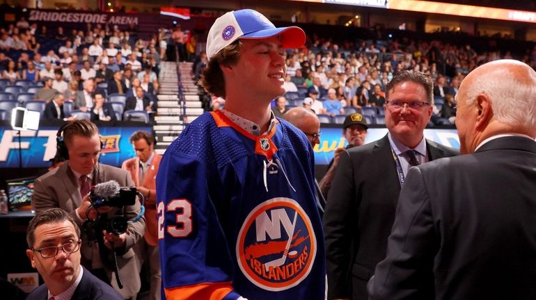 Danny Nelson celebrates after being selected 49th overall by the...