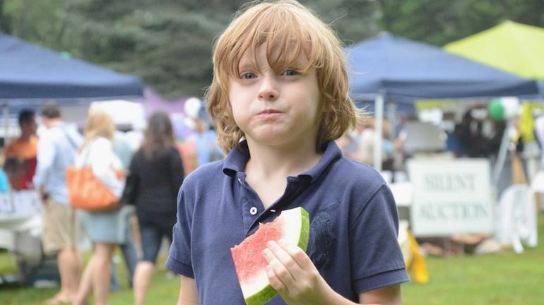 Hudson Kulik, 5, of East Hampton, gobbled down a slice...