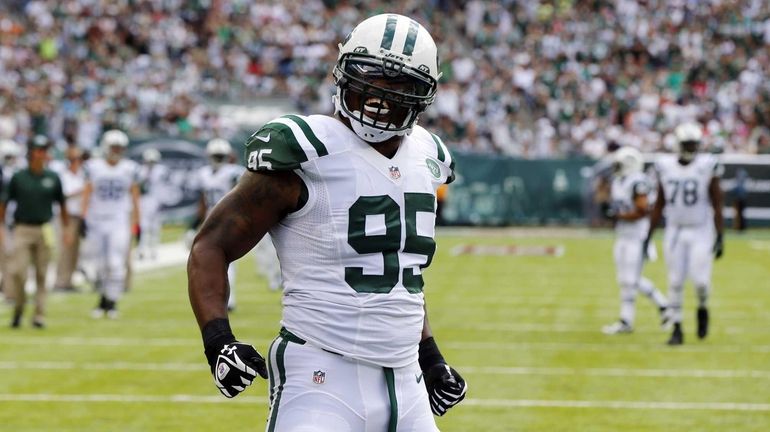 Jets defender Antwan Barnes celebrates his first-half safety against the...