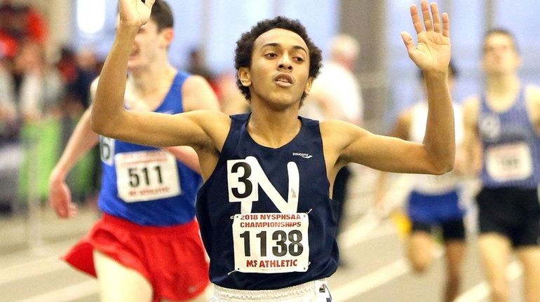 Isaiah Claiborne of Northport wins the boys 1,000-meter run in...