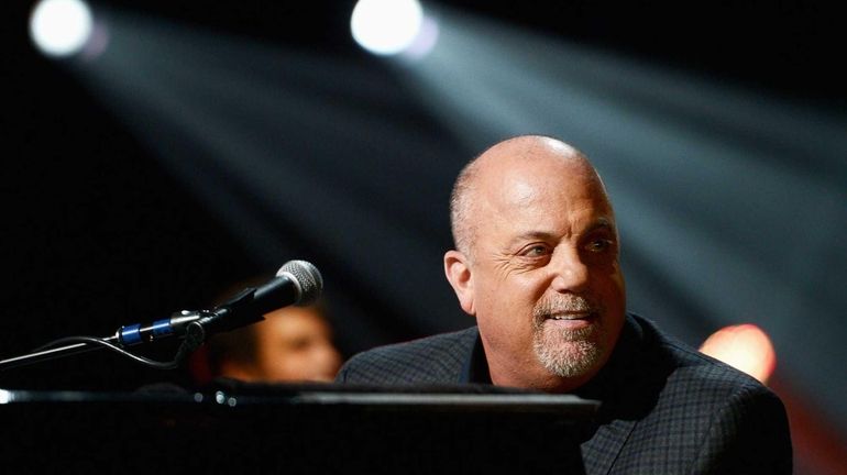 Billy Joel performs at the 12-12-12 concert at Madison Square...