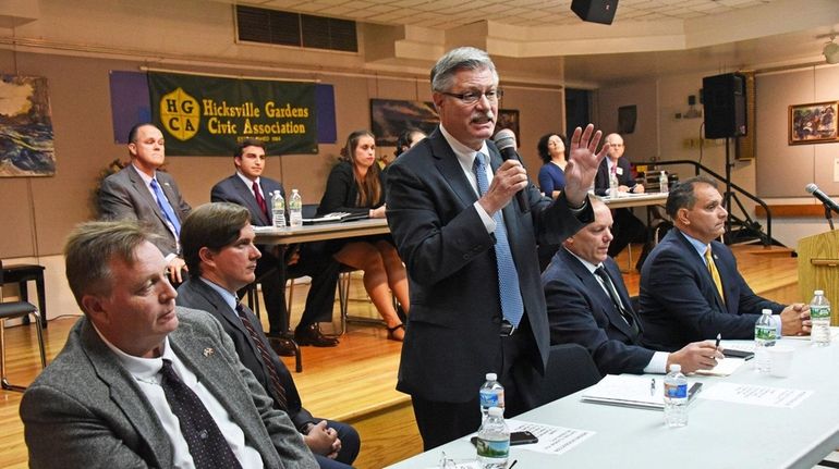 Candidates for Oyster Bay Town supervisor, from left in front...