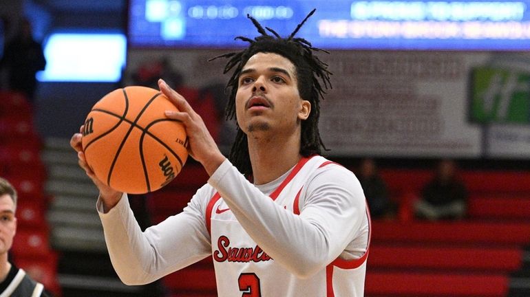 Stony Brook forward Frankie Policelli shoots a free throw late...