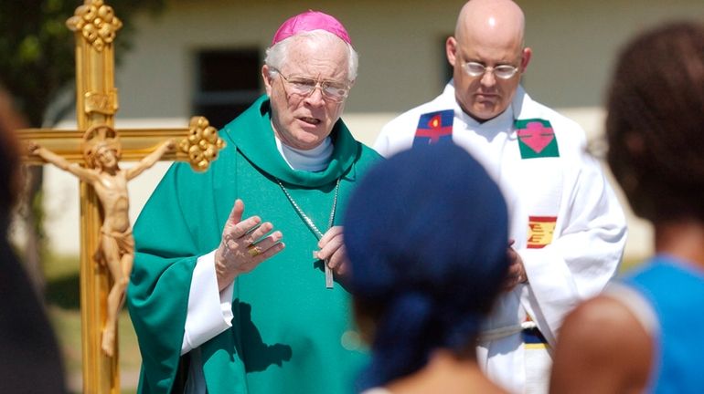 Edward Slattery, bishop of the Diocese of Tulsa, celebrates Mass...