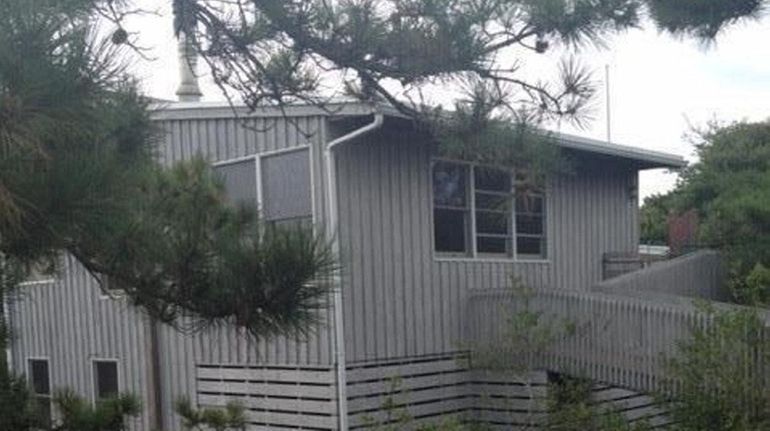 The three-bedroom, two-bathroom beach house built in 1958 is on...