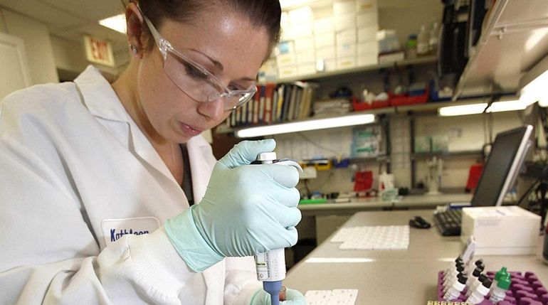 A Chembio scientist works on the company's test for HIV-syphilis...