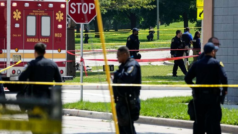 Police investigate a shooting near King Park during the second...