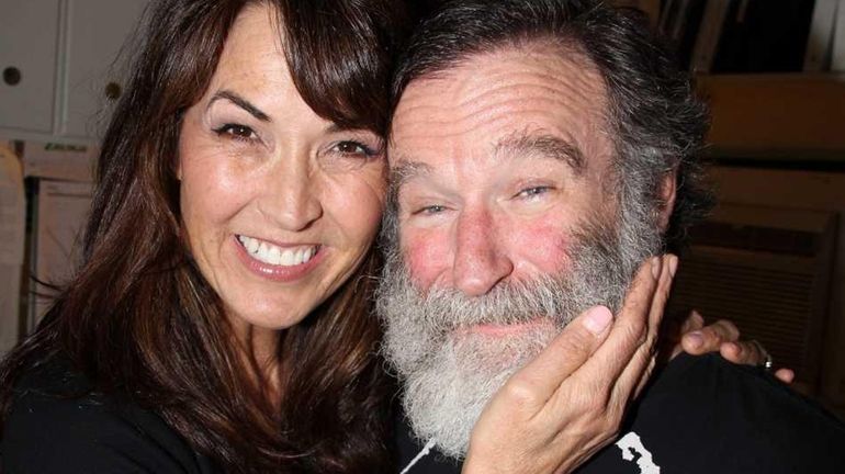 Susan Schneider and fiancee Robin Williams pose backstage at the...