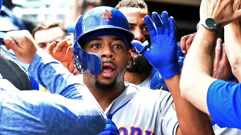 Mets outfielder Dominic Smith celebrates his three-run home run in...