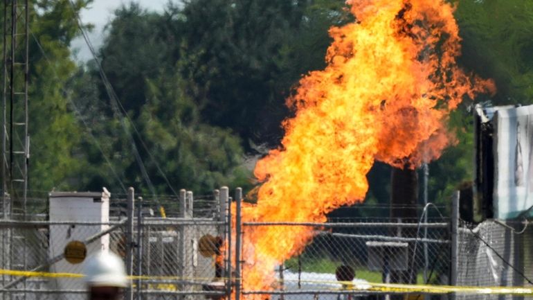 An above-ground valve continues to burn three days after after...