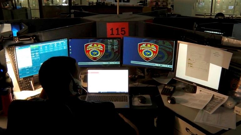 A 911 operator receives a 911 call at police headquarters...