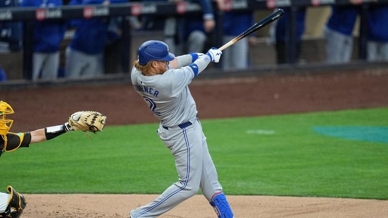 Toronto Blue Jays' Justin Turner watches his RBI single during...