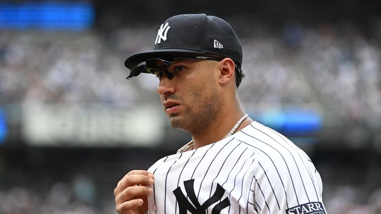 New York Yankees second baseman Gleyber Torres walks to the...