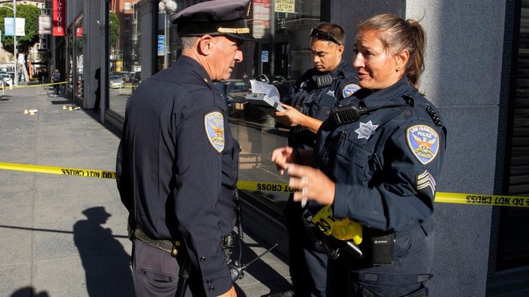 San Francisco Police Department Sgt. Joelle Harrell, right, at the...