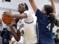 The Stony Brook School's Catherine Banahene helps hand St. Dominic first loss