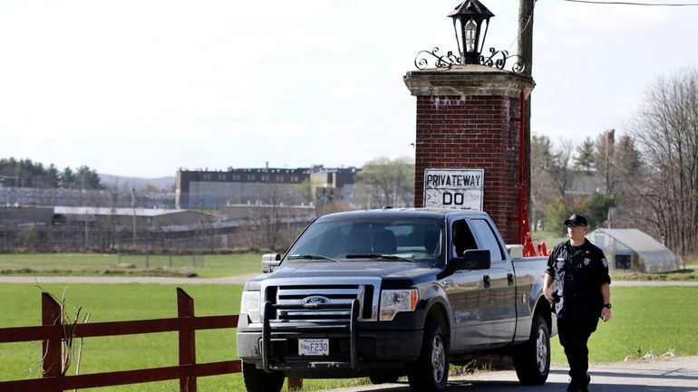 A police officer guards an entrance to the Souza-Baranowski Correctional...