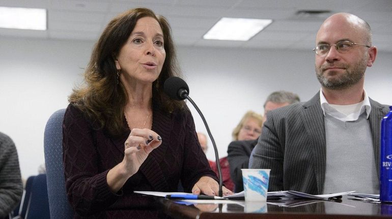 Adrienne Esposito, center, of Citizens Campaign for the Environment, testifies...