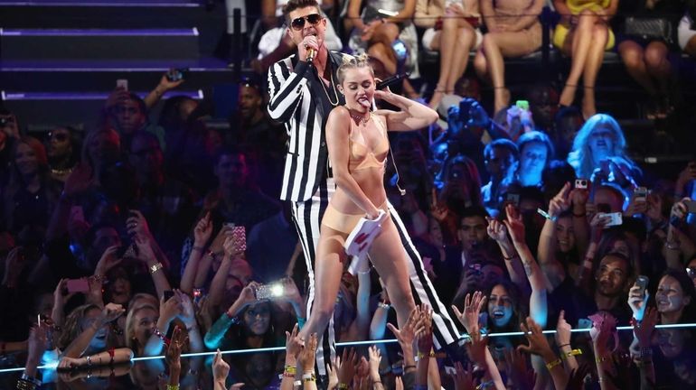 Miley Cyrus and Robin Thicke perform during the 2013 MTV...