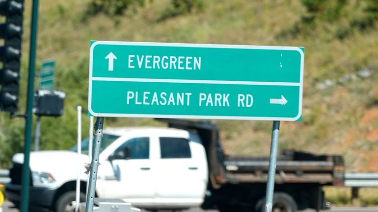 A sign off Highway 285 points motorists to Pleasant Park...