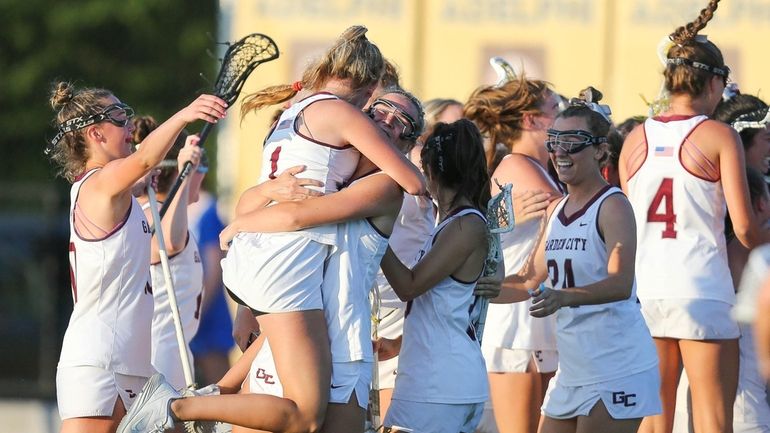 Garden City celebrates their win during the Nassau Class B...