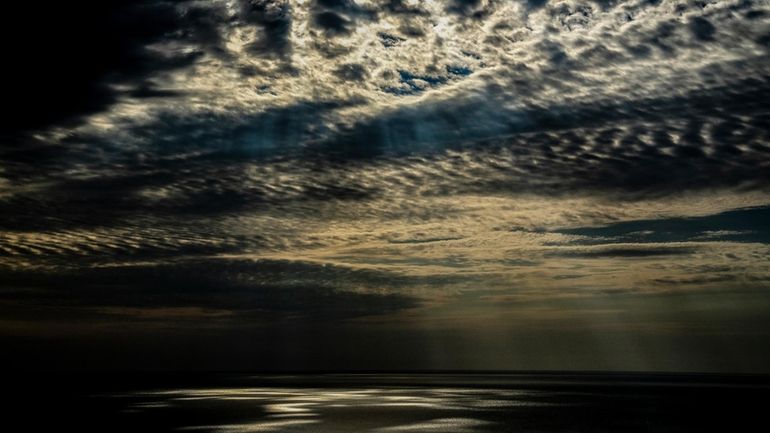 Light is reflected on part of the Aral Sea outside...