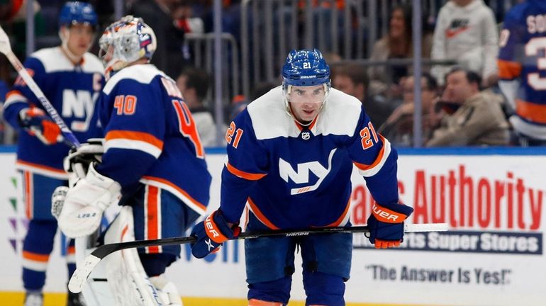 Kyle Palmieri #21 of the Islanders looks on after the...