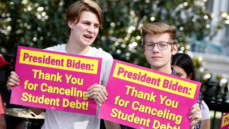 Student loan borrowers stage a rally in front of the...