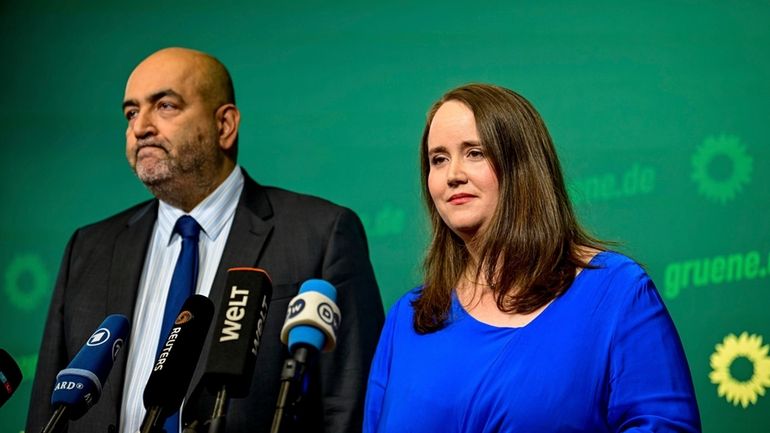 Green Party Chairwoman Ricarda Lang, right, and Omid Nouripour speak...