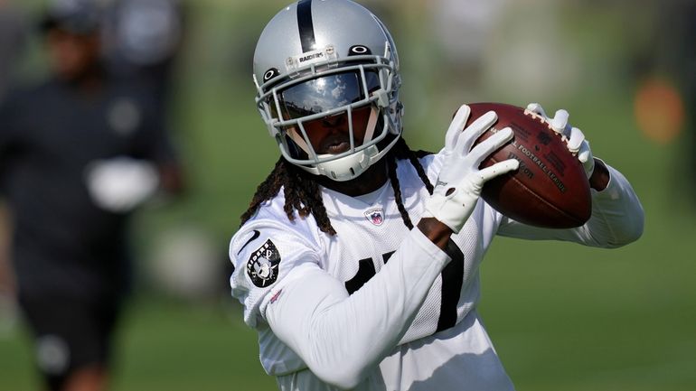 Las Vegas Raiders' Davante Adams catches a pass during NFL...