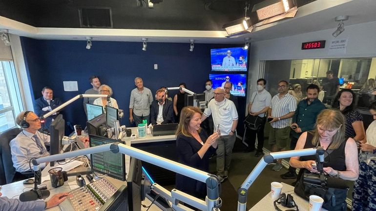 Inside a WCBS/880 AM studio last week as staffers past an present...