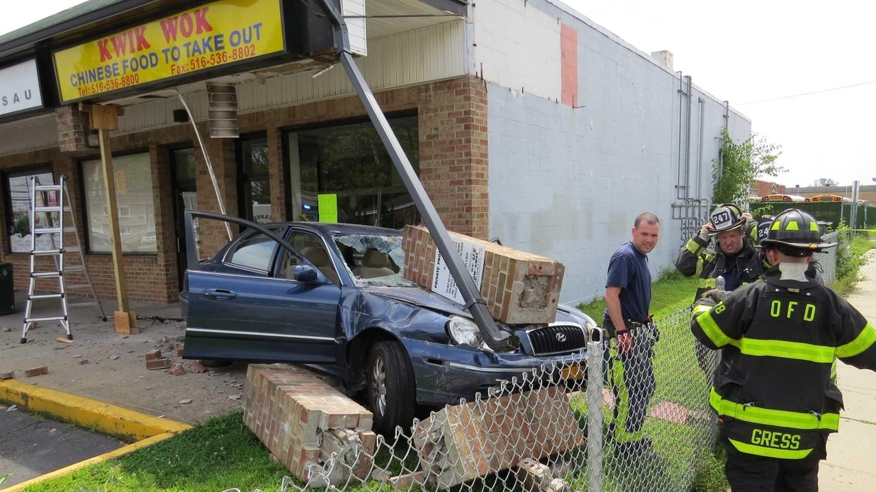 Car crashes into Oceanside strip mall after jumping curb - Newsday