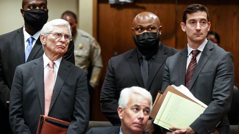 Former Memphis Police Officers Emmitt Martin III, back left, and...