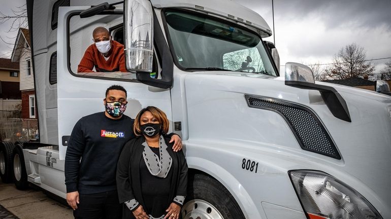 Elizabeth Wellington and her husband, Antonio, in truck, with their...