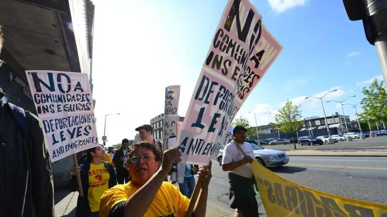 More than two dozen people marched down Fulton Avenue in...