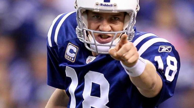 Peyton Manning of the Indianapolis Colts points in the first...