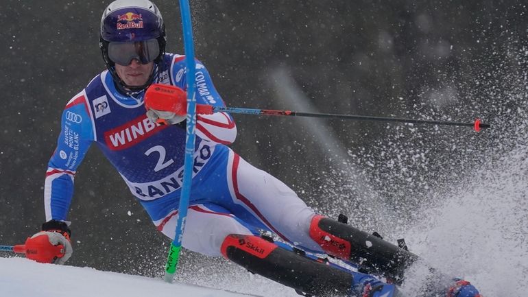 France's Clement Noel speeds down the course during an alpine...