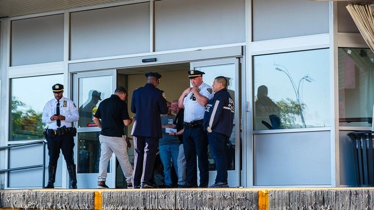 NYPD officials outside the ambulance entrance to Brookdale Hospital on Sunday after...