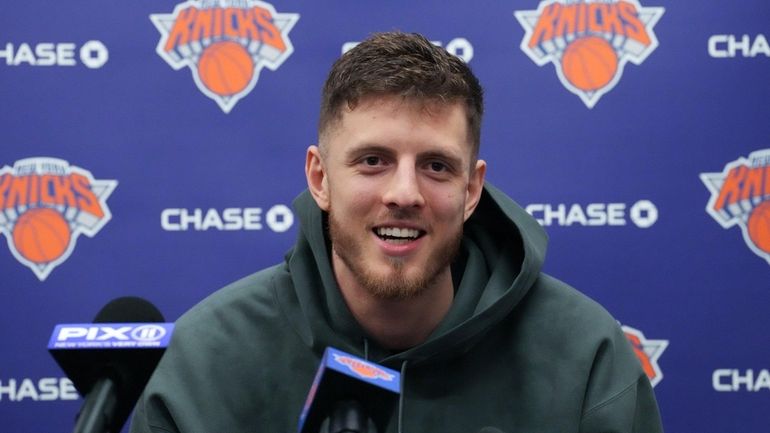 Isaiah Hartenstein of the Knicks answers questions from the media during...