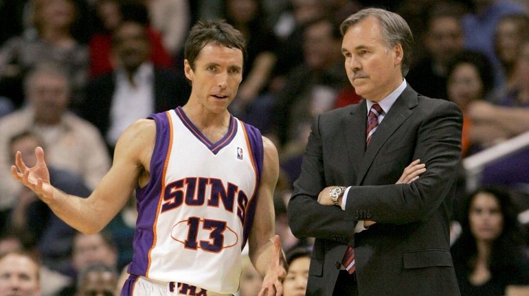 Suns guard Steve Nash, left, talks with head coach Mike...