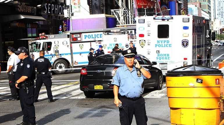 The NYPD's bomb squad check a suspicious package on Wednesday....