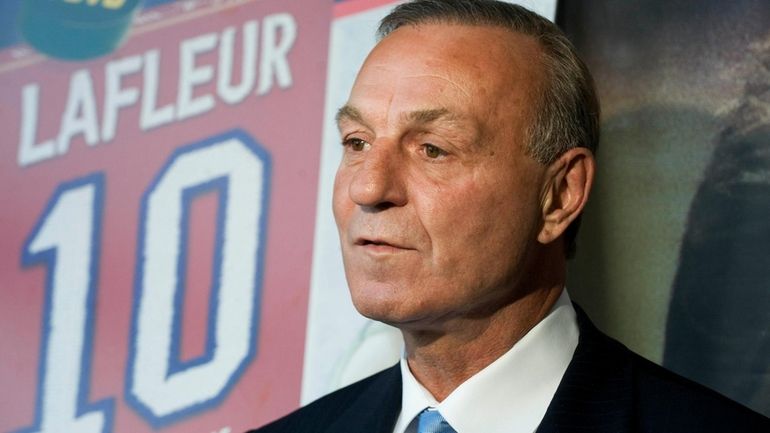 FILE -Hockey legend Guy Lafleur speaks to the media at...