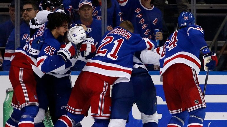 The Rangers and the Lightning mix it up late during the third...