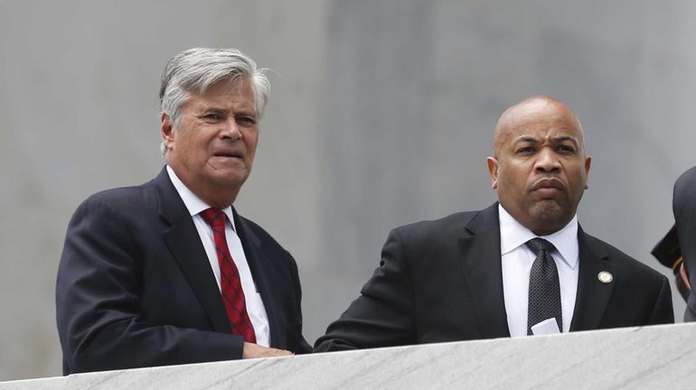 Senate Majority Leader Dean Skelos (R-Rockville Centre), left, stands with...