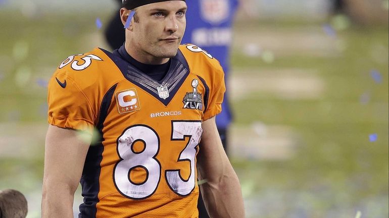 Denver Broncos wide receiver Wes Welker walks off the field...