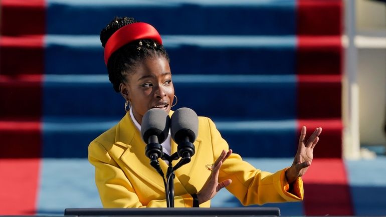 American poet Amanda Gorman recites a poem during the Inauguration...