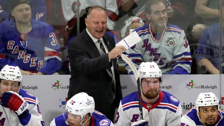 New York Rangers head coach Gerard Gallant, center top, directs...