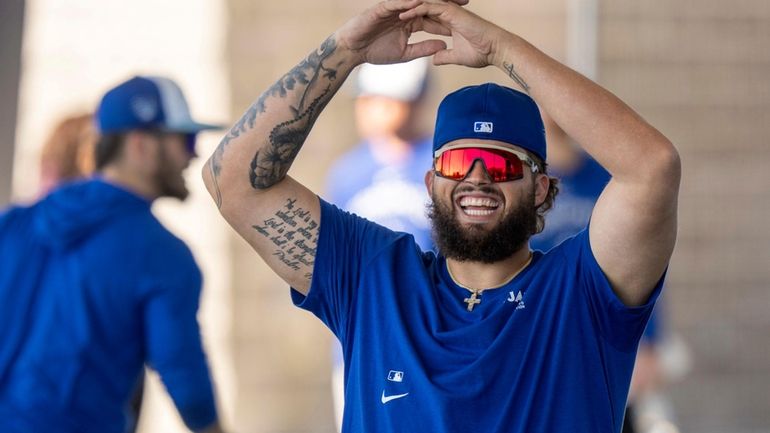 Toronto Blue Jays pitcher Alek Manoah warms up at baseball...